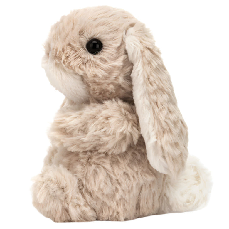 The Jellycat Yummy Bunny by Jellycat is a beige plush bunny stuffed animal with floppy ears, sitting upright and facing left against a white background.
