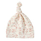 The Quincy Mae Knotted Baby Hat features a cream color with a pink floral pattern, made from soft brushed jersey.