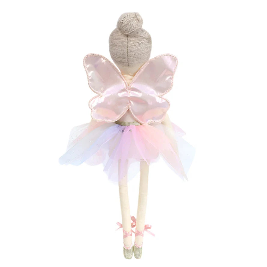 Introducing the MON AMI Yara Butterfly Ballerina by Mon Ami: This enchanting doll, ideal for imaginative play, stands proudly with her pastel fairy wings, tutu skirt, and ballet shoes. Her delicately embroidered face enhances her charm as she eagerly awaits her next dance.