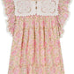 The Girls' Marise Dress by Louise Misha features a pink and green floral pattern with a white eyelet bib and ruffled sleeves.