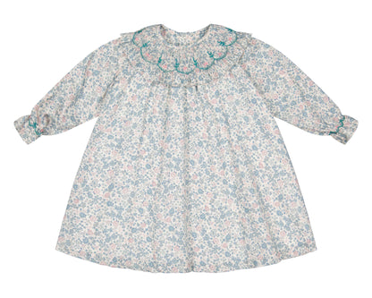 The Antoinette Yse Blue Floral Long Sleeve Bishop Dress features a ruffled embroidered collar and gathered cuffs in soft blue and pink florals—a charming spring outfit for your little one.