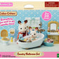 The Calico Critters Country Bathroom Set box showcases charming toy animals and exquisitely designed dollhouse furniture arranged in a detailed bathroom scene with accessories, recommended for children ages 3 and up.