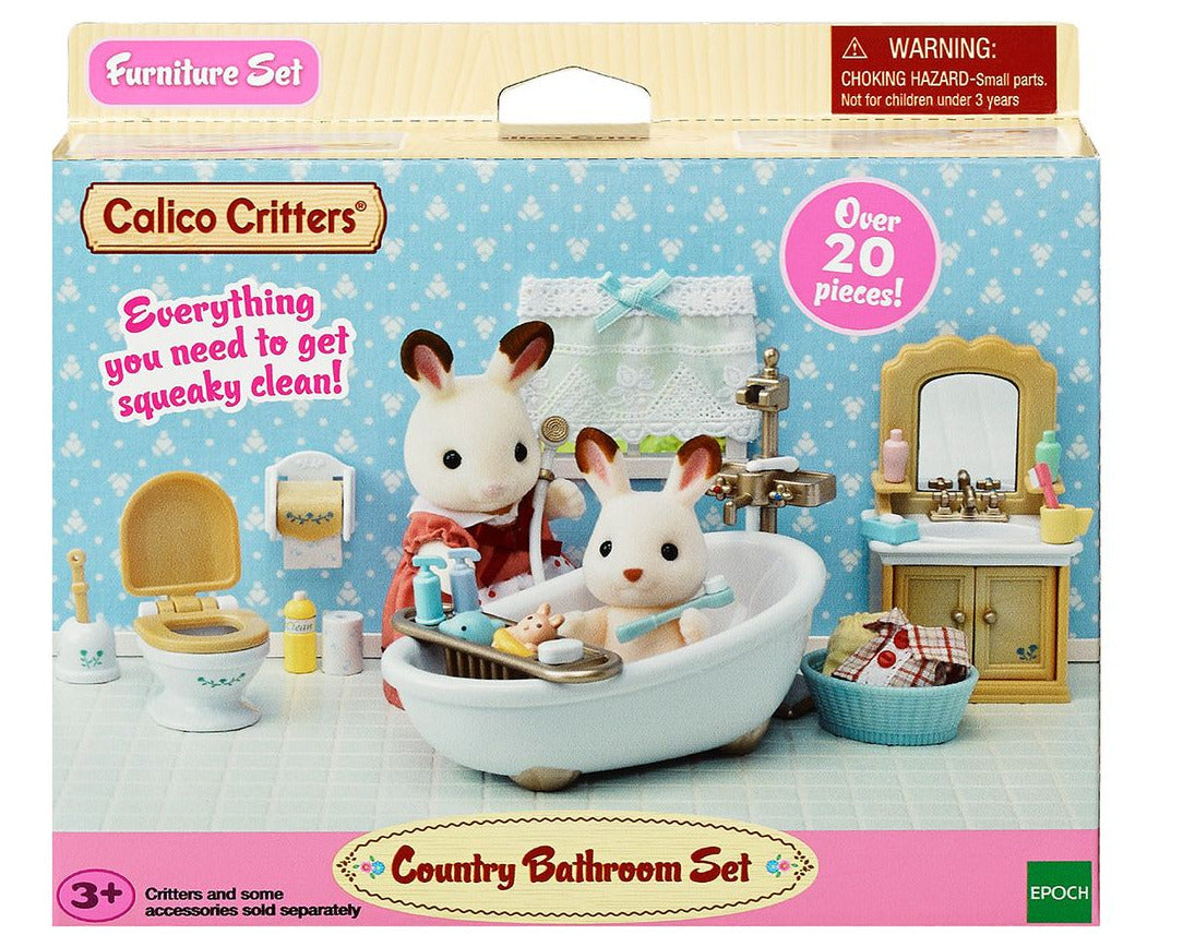The Calico Critters Country Bathroom Set box showcases charming toy animals and exquisitely designed dollhouse furniture arranged in a detailed bathroom scene with accessories, recommended for children ages 3 and up.