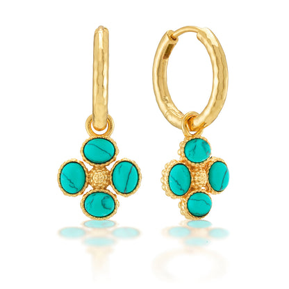 The Berry Clover Hoop Earrings with Double Sided Charm by Juliska Capucine De Wulf feature textured gold hoops and dangling clover charms, each set with four turquoise stones, for an elegant gemstone look.
