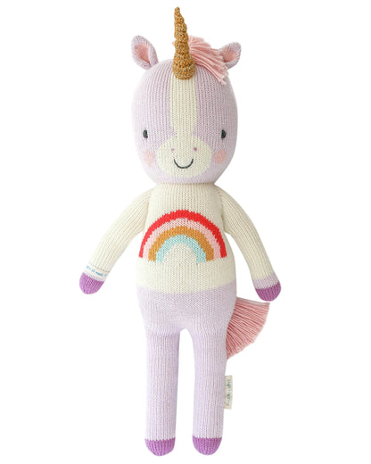 Meet Zoe the Unicorn by Cuddle + Kind—a 13" plush toy with a gold horn, pink mane and tail, rainbow belly, and light purple and cream body. Perfect for magical adventures in any mystical forest!.