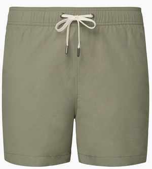 The Charles 5" Swim Trunk by Onia features a light olive green hue, classic tailoring, elastic waistband, white metal-tipped drawstring, and quick-dry fabric, shown against a plain background.