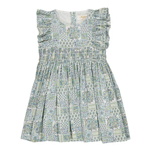 The Kidiwi Baby Girls' and Girls' Clarisse Smocked Dress features a sleeveless design in light green and white with floral and geometric patterns, ruffled shoulders, and a gathered waist in soft cotton poplin, shown on a plain white background.