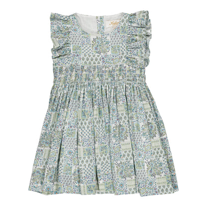 The Kidiwi Baby Girls' and Girls' Clarisse Smocked Dress features a sleeveless design in light green and white with floral and geometric patterns, ruffled shoulders, and a gathered waist in soft cotton poplin, shown on a plain white background.