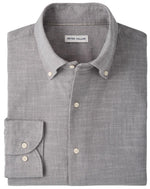 A folded light gray “Devonport Chambray Cotton-Stretch Sport Shirt” by Peter Millar, featuring a visible brand label inside the collar—ideal for elevating your casual style.