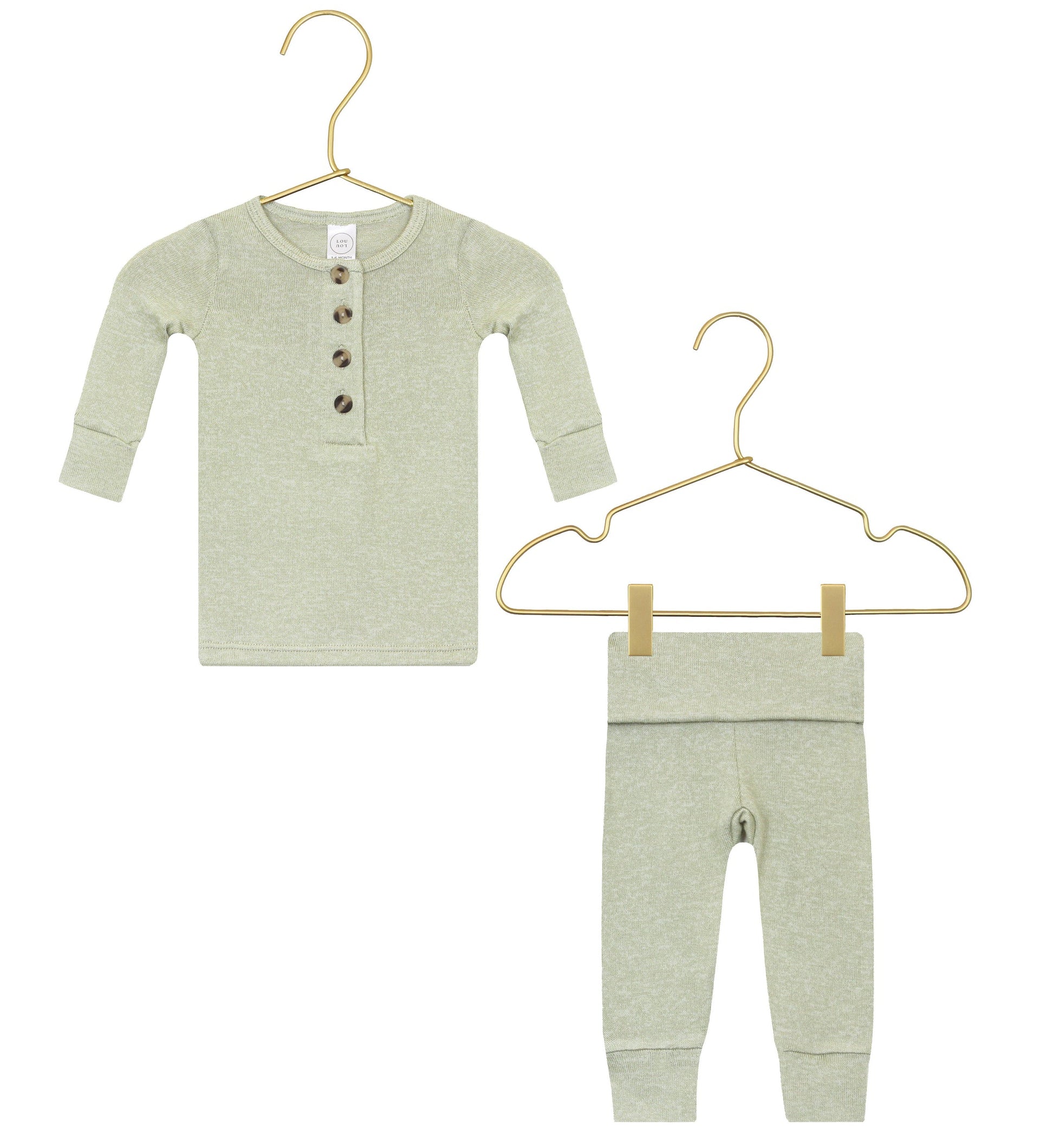 The Lou Lou & Company Baby Collins Plush Knit Top & Bottoms set, shown in light green, features a long-sleeve button-up shirt and matching pants with a fold-over waistband, both displayed on gold hangers against a white background.