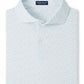 A light blue Peter Millar Soprano Waves Performance Jersey Polo with UPF 50+ sun protection and a subtle wave pattern, neatly folded with the collar up and two buttons visible.