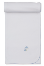 The Premier Sweet Sheep Blanket by Kissy Kissy is a white rolled Pima cotton baby blanket featuring blue scalloped edges and a small embroidered blue puppy motif near one corner.