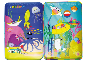 The Floss and Rock Ocean Magnetic Playtime Tin includes two colorful trays decorated with playful cartoon sea creatures—such as an octopus, ray, squid, jellyfish, fish, and crabs—set against vibrant underwater scenes filled with coral and plants. Crafted from recycled materials, this fun playset is both eco-friendly and imaginative.