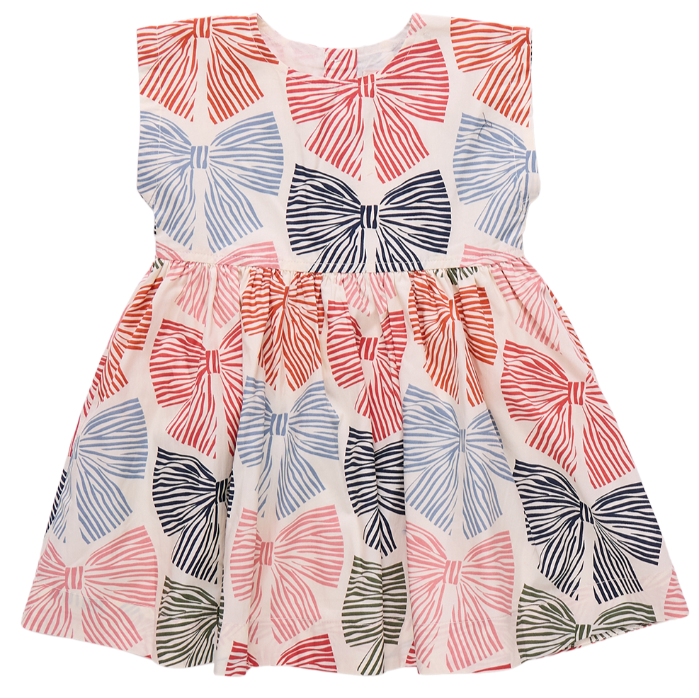The Girls' Adaline Dress by Pink Chicken is a sleeveless kids' dress with large multicolored striped bows on a crisp white background.