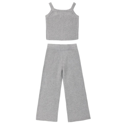 The Girls’ Fuzzy Knit Lounge set by Rylee & Cru features a cozy gray ribbed knit two-piece ensemble, including a sleeveless crop top with wide shoulder straps and matching wide-leg pants, both displayed flat on a white background—making it the ideal lounge set for relaxing in style.