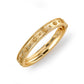 The Berry Classic Hinged Bangle by Juliska Capucine De Wulf features a textured band with intricate edge and raised circular details, showcasing timeless golden elegance. Photographed on a white background.