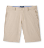 The Peter Millar Matlock Seersucker Performance Short is a beige pair with belt loops, front pockets, and a button closure, shown against a white background.
