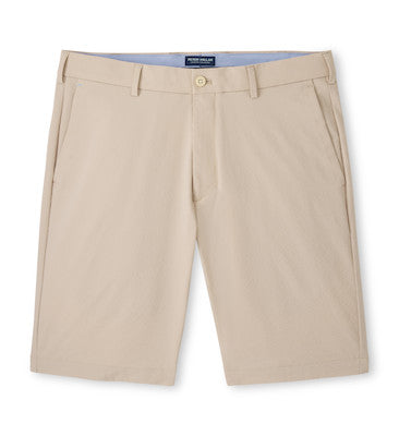 The Peter Millar Matlock Seersucker Performance Short is a beige pair with belt loops, front pockets, and a button closure, shown against a white background.