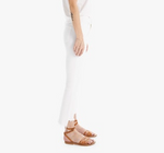 A person stands sideways against a white background, wearing The Insider Crop Step Fray by Mother and brown sandals.