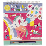 The Floss and Rock Fantasy Paint By Numbers kit is a spiral-bound art set for kids ages 5 and up, featuring a vibrant pink background with polka dots, and playful designs including a colorful unicorn, rainbow, stars, bird, and paintbrush.