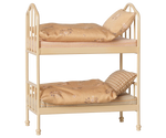 A cozy Wheat Bunk Bed - Mouse by Maileg, featuring a small beige metal frame with floral-patterned bedding and pillows on both the top and bottom bunks, set against a plain background—ideal for sleepovers at Mouse Hole Farmhouse.