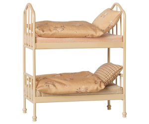 A cozy Wheat Bunk Bed - Mouse by Maileg, featuring a small beige metal frame with floral-patterned bedding and pillows on both the top and bottom bunks, set against a plain background—ideal for sleepovers at Mouse Hole Farmhouse.