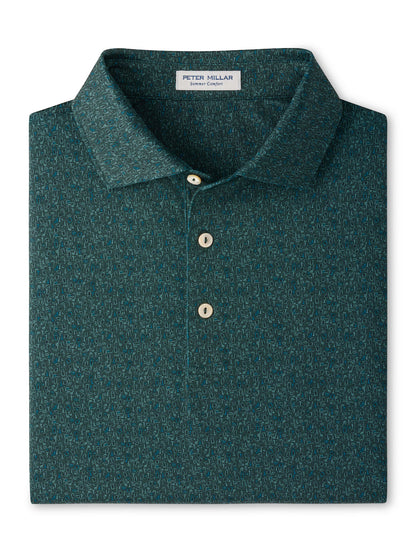 Peter Millar Transfusion Performance Jersey Polo in dark green with a small, abstract geometric pattern, three light-colored buttons, and UPF 50+ protection.