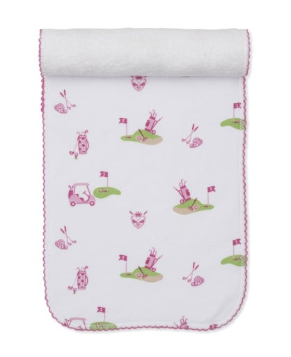 The Kissy Kissy Golf Championship Burp Cloth in pink and green features golf bags, carts, flags, and clubs—pair it with our matching white baby blanket for a perfect gift from our Golf Championship Collection.