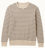 The Faherty Double Knit Crewneck is a beige sweater made from soft Pima cotton with even navy stripes and ribbed cuffs and hem.
