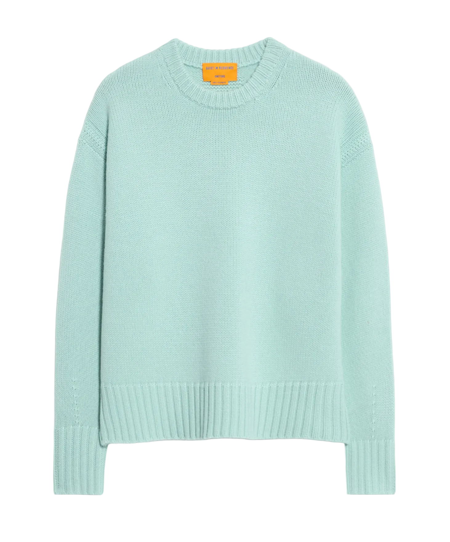 The Guest in Residence Cozy Crew Cashmere Sweater in light blue features long sleeves, a dropped shoulder, and ribbed cuffs, hem, and neckline, shown on a plain white background.