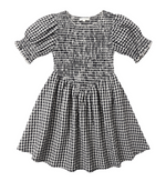 The Girls' Louise Dress by Rylee & Cru features black and white gingham, short puff sleeves, a shirred smocked bodice, and a gathered flared skirt, shown laid flat on a white background.