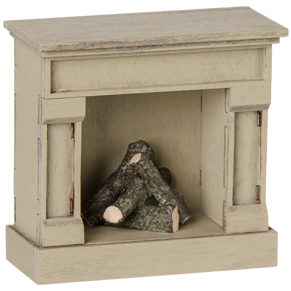 The Maileg Fireplace, Mouse - Off White is a small, wooden model fireplace with a vintage finish and faux logs inside the firebox—perfect for adding charm to your miniature home.