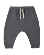 The Quincy Mae Baby and Kids’ Drawstring Pant, shown here in dark gray, is crafted from soft organic brushed jersey and features an elastic waistband, cream drawstring, and cuffed ankles. The pants are displayed laid flat on a white background.