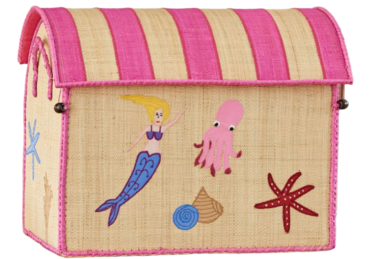 The Rice Raffia Toy Basket from the brand Rice is a straw box featuring a pink-striped lid, crafted from natural materials and adorned with illustrations of a mermaid, pink octopus, blue fish, shell, and red starfish. This delightful piece captures the handmade artistry of Madagascar's raffia storage baskets.