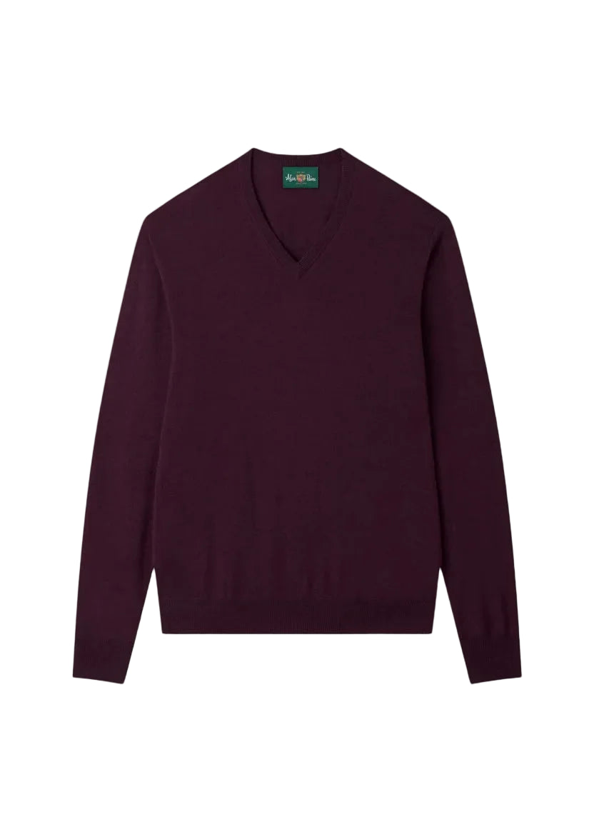 The Alan Paine Millbreck V-Neck Merino Wool Sweater, featuring long sleeves and a rich dark maroon hue, is laid flat on a white background to highlight its classic knitwear design—an ideal men’s layering piece.