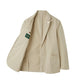 The Alan Paine Bridgeford Summer Blazer is a beige men's blazer featuring notch lapels, patch pockets, and a pin on the left lapel. Shown open to reveal its inner pocket and distinctive green label, this smart-casual blazer is crafted from breathable cotton—providing an ideal blend of comfort and style for warm-weather occasions.
