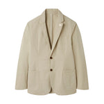 The Alan Paine Bridgeford Summer Blazer is a light beige smart-casual jacket featuring two buttons, three front pockets, and a subtle lapel pin. Crafted from breathable cotton, it is displayed against a plain white background.