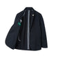 Introducing the Bridgeford Summer Blazer by Alan Paine—a black smart-casual blazer featuring an open left side that reveals a striking striped black and white interior lining along with a green label inside the pocket area. Expertly crafted from breathable cotton, this blazer delivers exceptional comfort and style, making it an ideal choice for versatile wear.