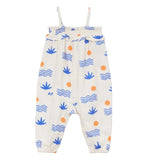 The Arsene & Les Pipelettes Baby Girls' Aloe Overalls are crafted from GOTS-certified organic cotton and adorned with playful blue waves, blue plant motifs, and cheerful orange dots. Designed with shoulder straps and a ruffled top edge, these stylish overalls offer a modern twist on the classic romper.