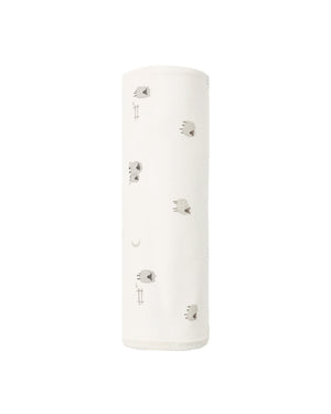 A soft baby swaddle from Quincy Mae, made of organic brushed jersey in white and featuring small gray and beige sheep illustrations, shown rolled up against a plain white background.