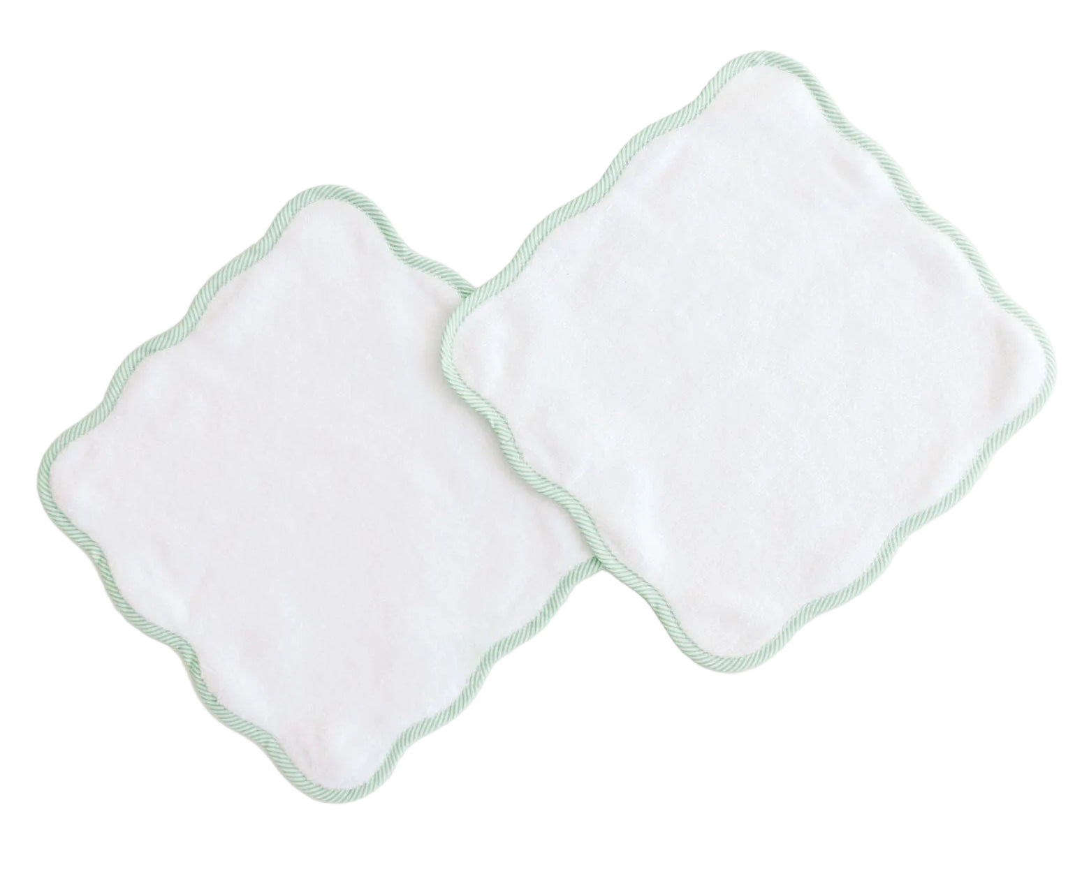 The Terry Tots Wash Cloth Set features two white, square plush wash cloths with scalloped edges and light green striped trim, overlapping on a white background and designed for gentle cleansing.