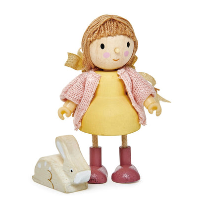 Amy & Her Rabbit by Tender Leaf Toys features a wooden doll with brown hair, a yellow dress, pink shoes, and a pink knitted cardigan standing next to a small white wooden rabbit.