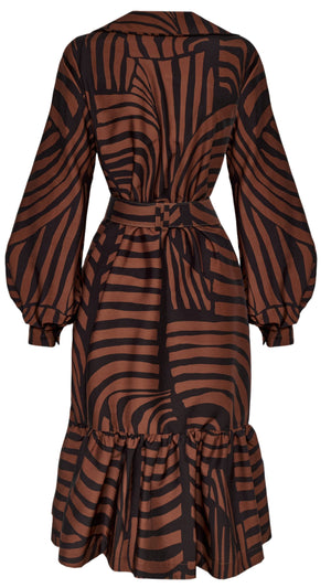 The rear view of the Andres Otalora De Mi Vida Dress showcases a long-sleeve design with a black and brown abstract stripe pattern, featuring balloon sleeves, a belted waist, and a ruffled hem. The elegant design is further highlighted by its sophisticated A-line silhouette.