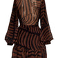 The Andres Otalora Roa Mini Dress by Andres Otalora is a sheer dress in brown and black stripes, featuring long sleeves and a high ruffled neckline. Crafted from recycled polyester, it showcases a fitted waist and ruffled hem, blending elegance with eco-conscious design.