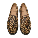 A pair of Ann Mashburn Lug Sole Loafers featuring leopard print uppers, black soles, and tan insoles branded with the Ann Mashburn name.