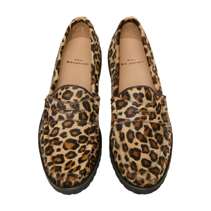 A pair of Ann Mashburn Lug Sole Loafers featuring leopard print uppers, black soles, and tan insoles branded with the Ann Mashburn name.