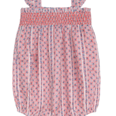 The Minnow Baby Girls' Floral Tile Smocked Bubble Romper features a pink and white floral pattern, smocked bodice, wide straps, and elastic leg openings—an adorable design for easy diaper changes.