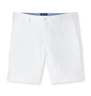 The Peter Millar Surge Short: white, knee-length, water-resistant shorts with belt loops, front pockets, and a button closure—versatile performance apparel for any activity.