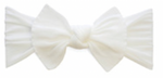 The Baby Bling Classic Knot Headband by Baby Bling is fashioned from high-quality fabric, showcasing a white bow with a central knot and symmetrical folds on each side.