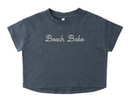 The Rylee & Cru Baby Girls' and Girls' Boxy Tee is a navy blue, short-sleeve crop top with "Beach Babe" embroidered in white on the front.